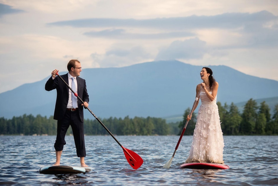 02-bride-and-groom-paddleboarding-by-fun-and-creative-new-england-wedding-photographer