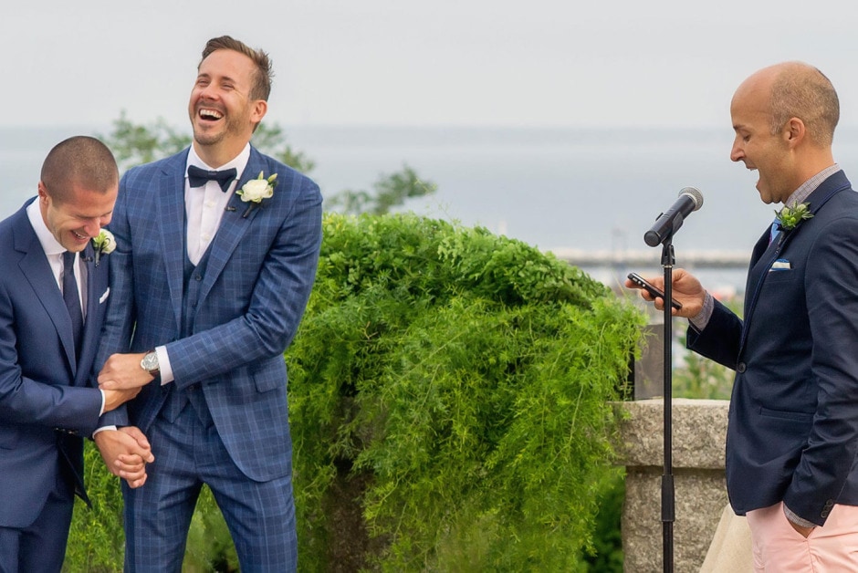 07-gay-friendly-new-england-wedding-photographer-grooms-laughing-during-ceremony