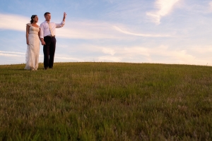 bride and groom wave to guests at their rose farm inn wedding on block island