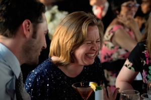 guest laughing during toasts