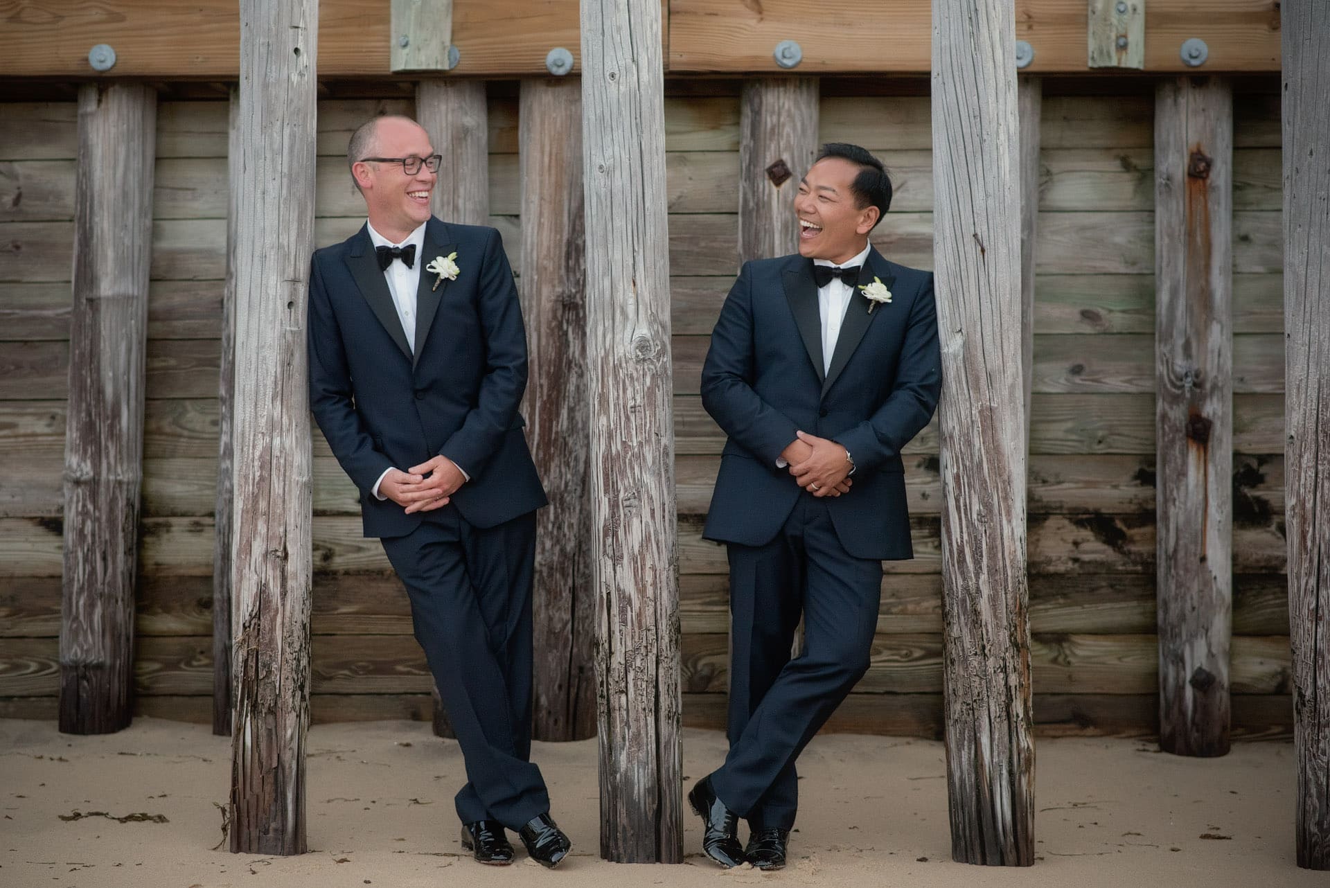 two grooms on beach at their Red Inn Provincetown wedding