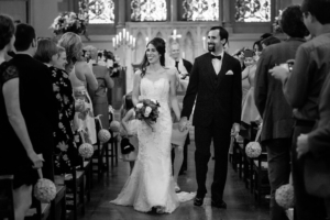 bride and groom exit church at gordon chapel wedding ceremony