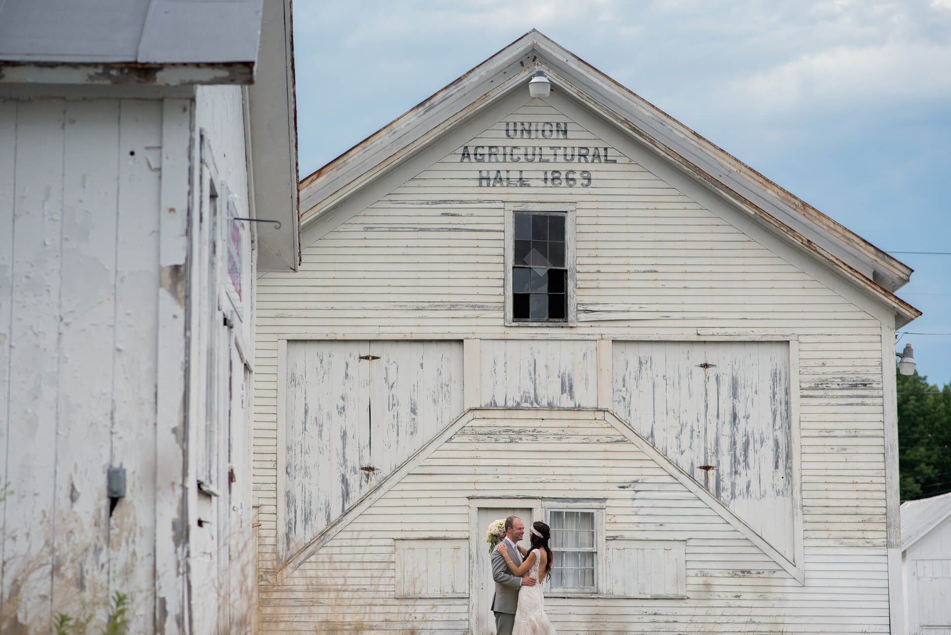 portrait of bride and groom in old fairground at a Berkshires wedding