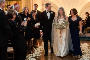 bride's parents escort her into her Jewish ceremony in the oval room at a fairmont copley wedding