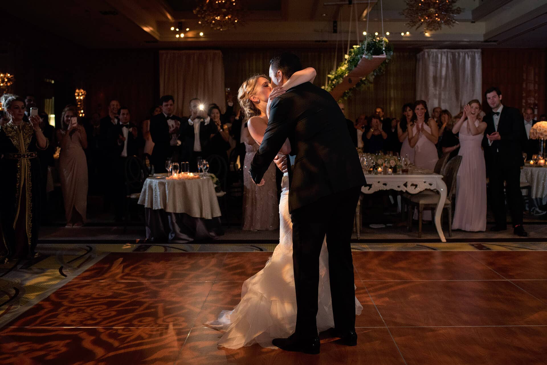 mandarin oriental boston wedding kiss at end of first dance in ballroom