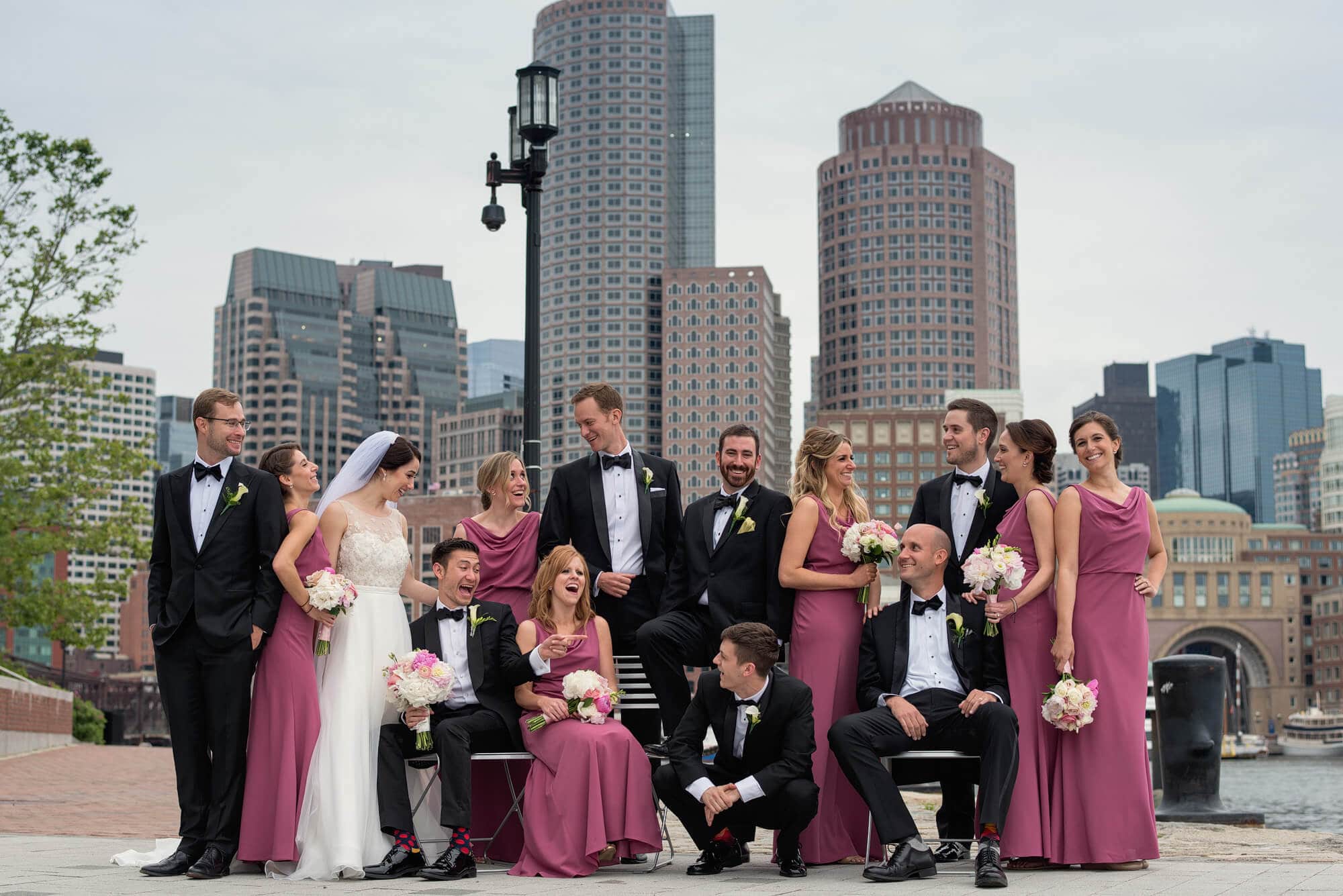 classic boston skyline wedding party portrait in the seaport district