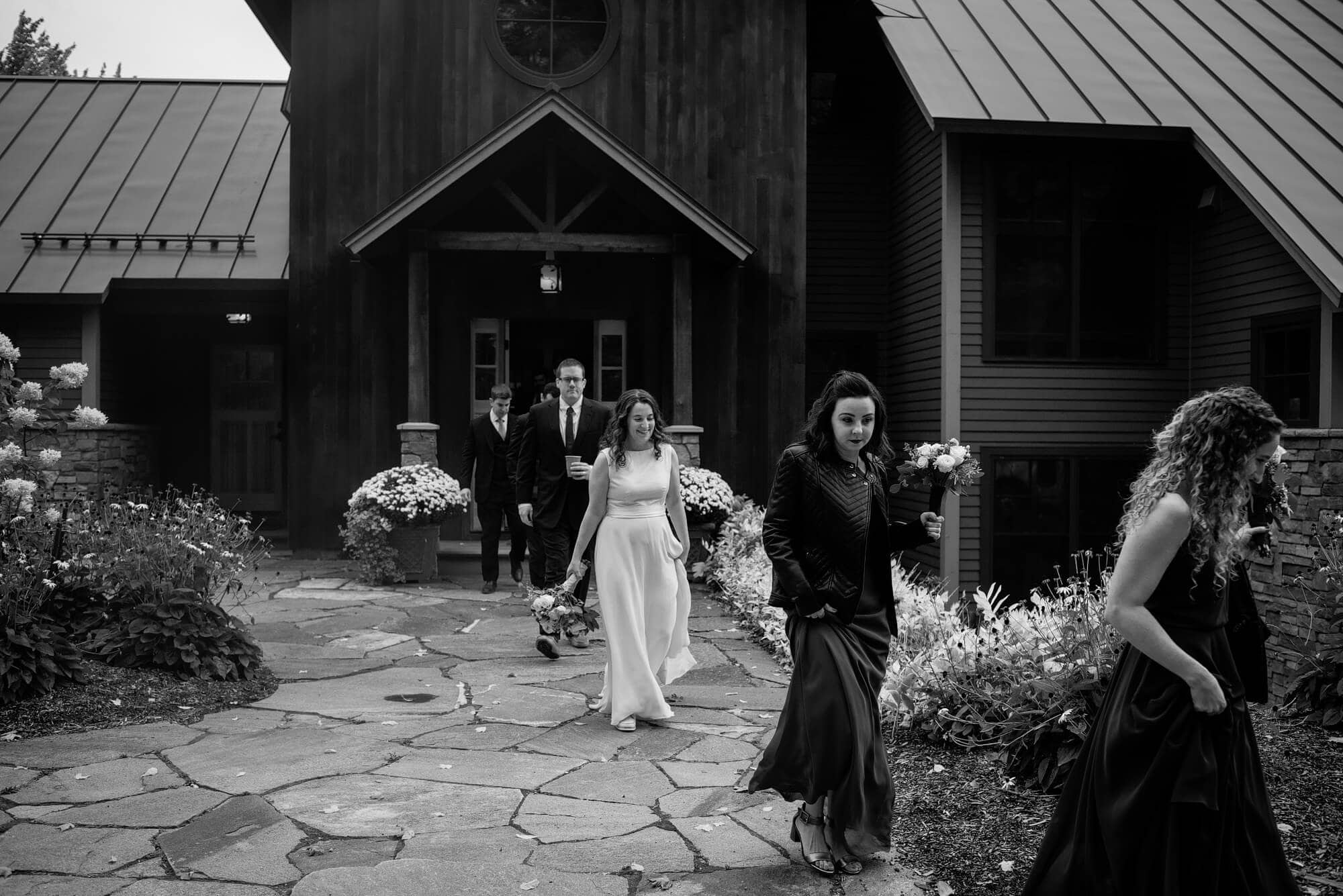 mountain top inn fall wedding party leaving house for ceremony