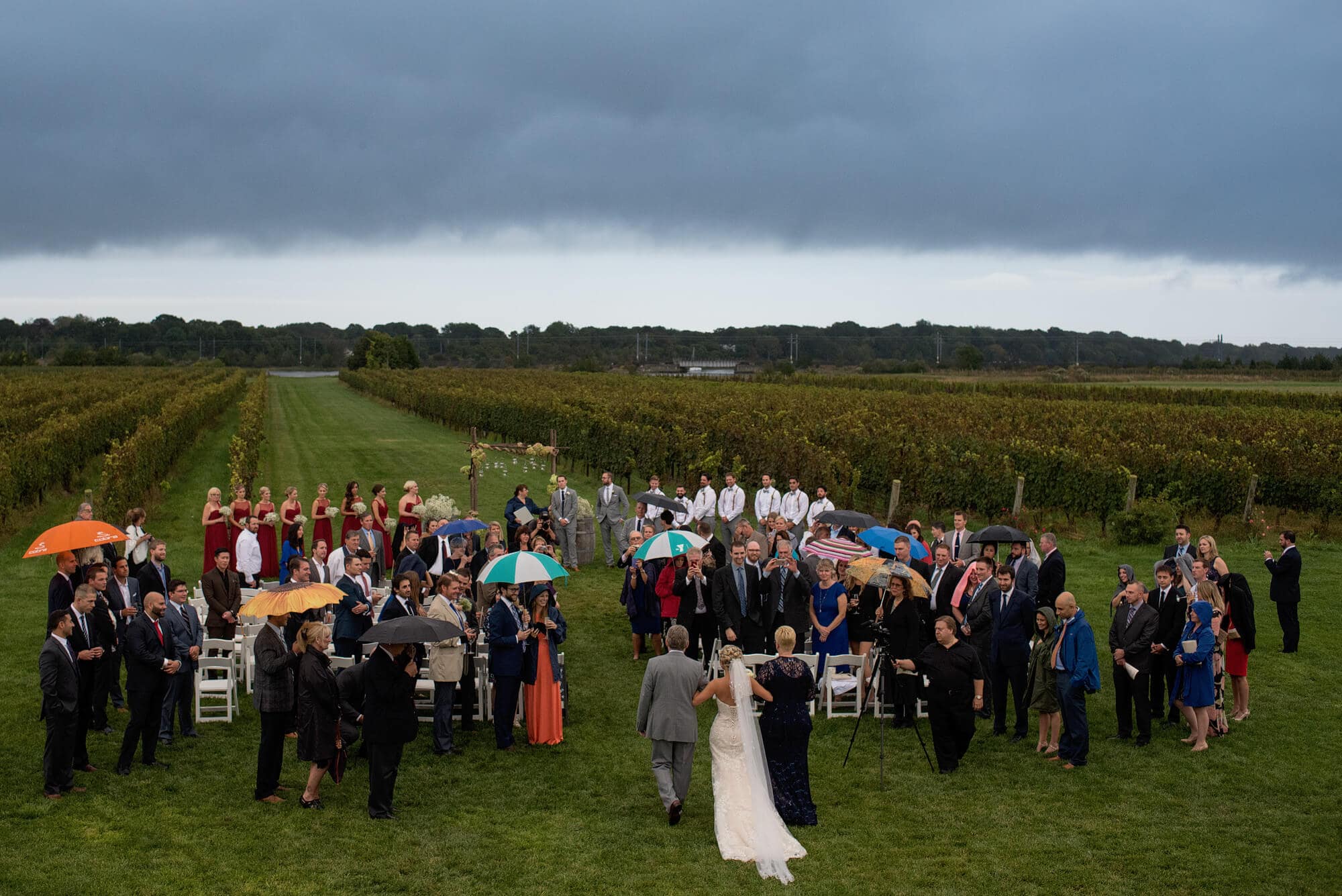 rainy wedding ceremony at saltwater farm vineyard