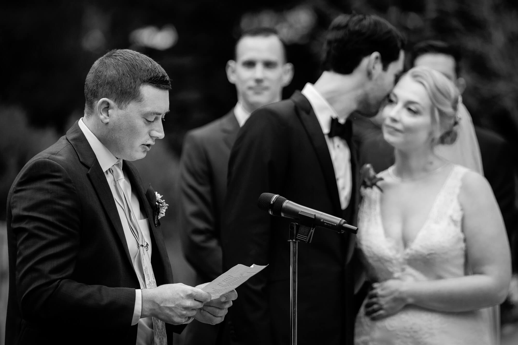 sweet moment during ceremony reading at connors center retreat wedding
