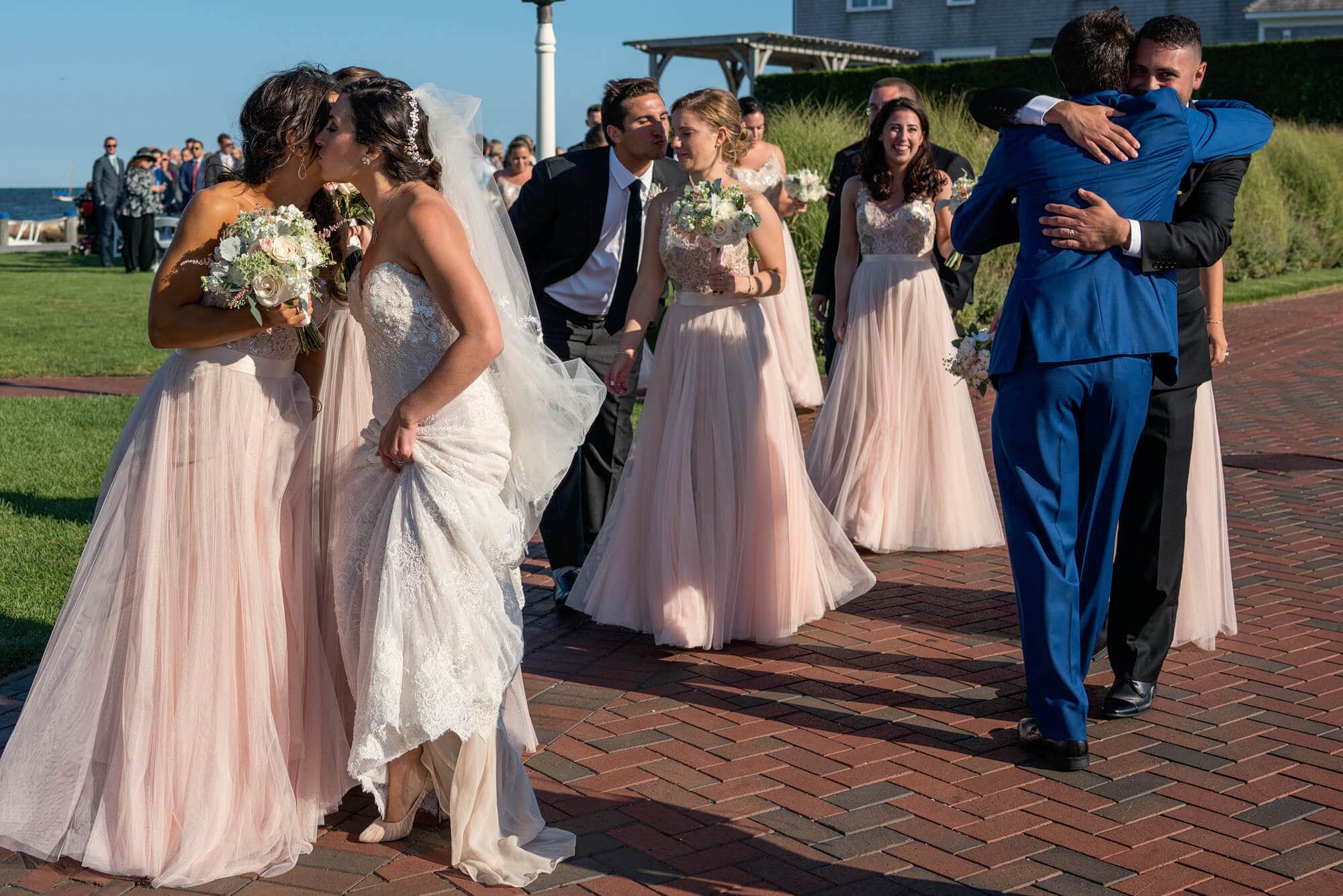 hugs after wedding ceremony at wychmere beach club