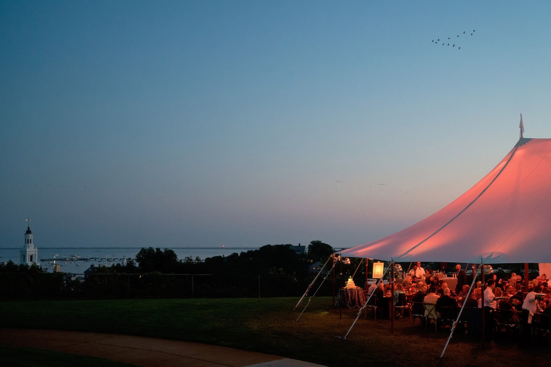 Provincetown Monument Wedding tent at night with view over P-Town
