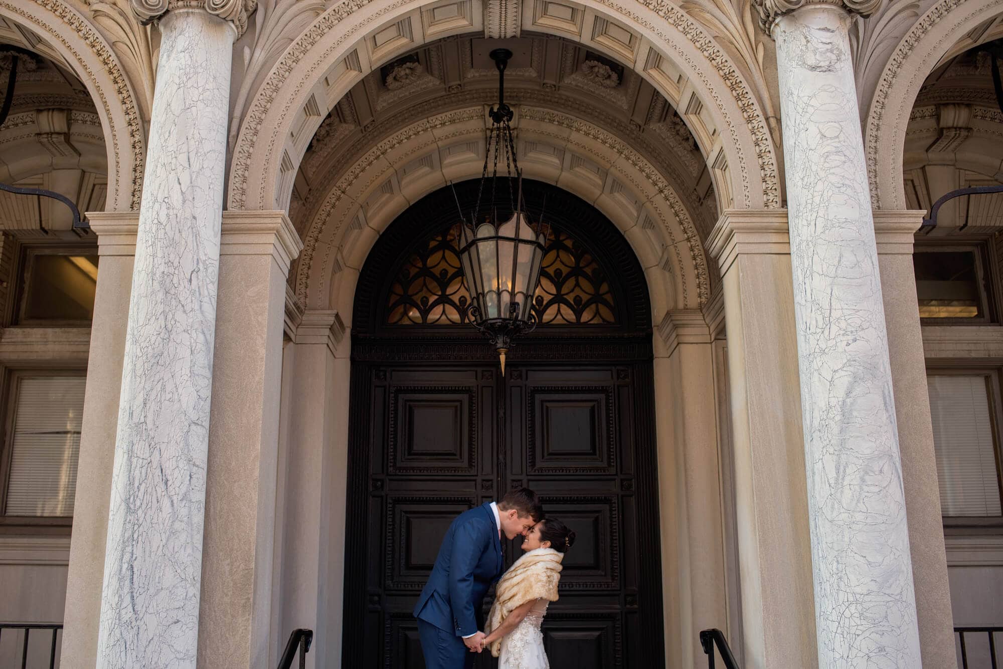 wedding photo of couple in front of Providence Public Library