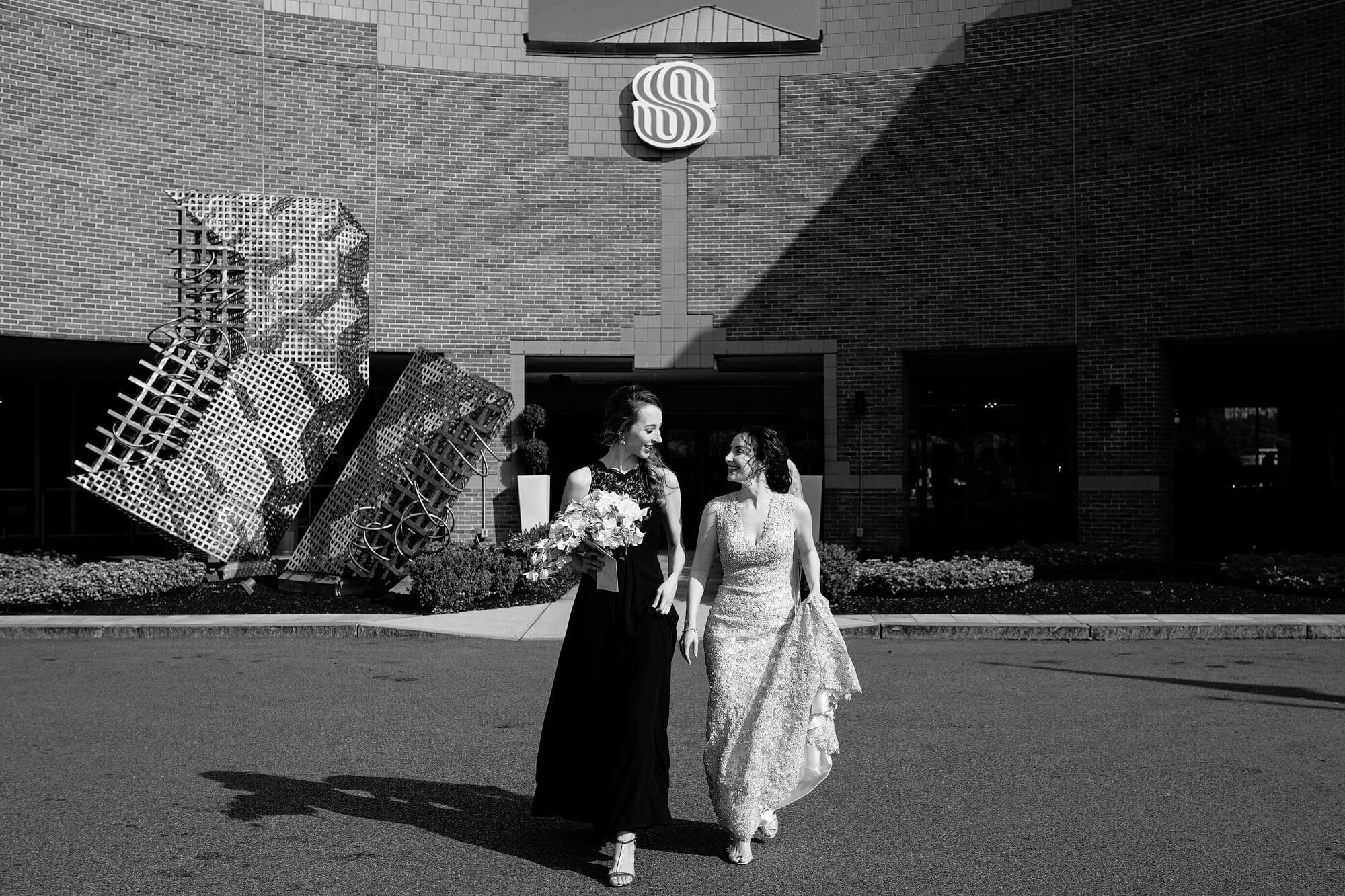 bride leaving hotel with best friend for first look