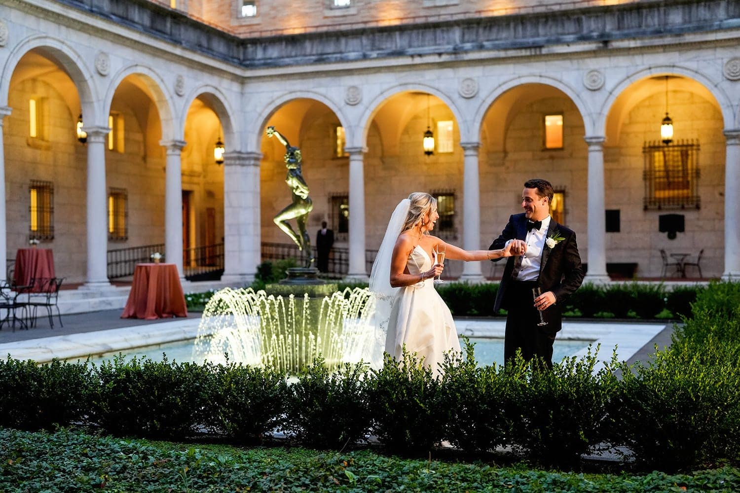 bride and groom in courtyard at their boston public library wedding