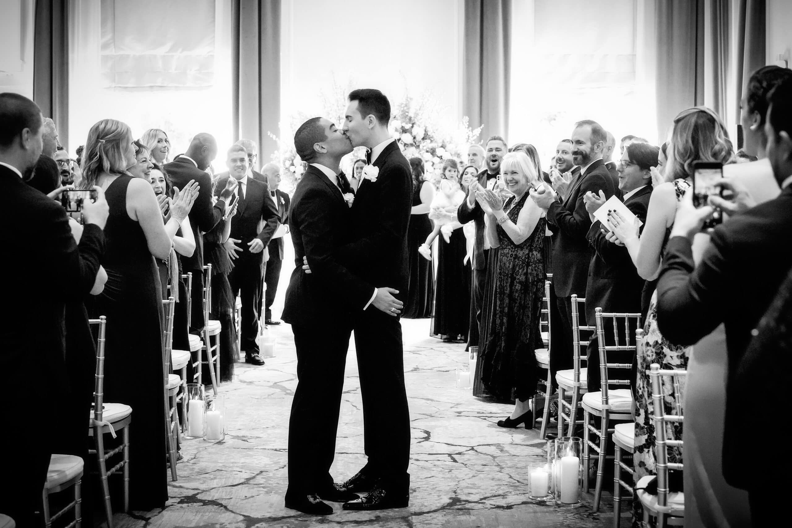 wedding photo at the newbury boston hotel - end of ceremony kiss