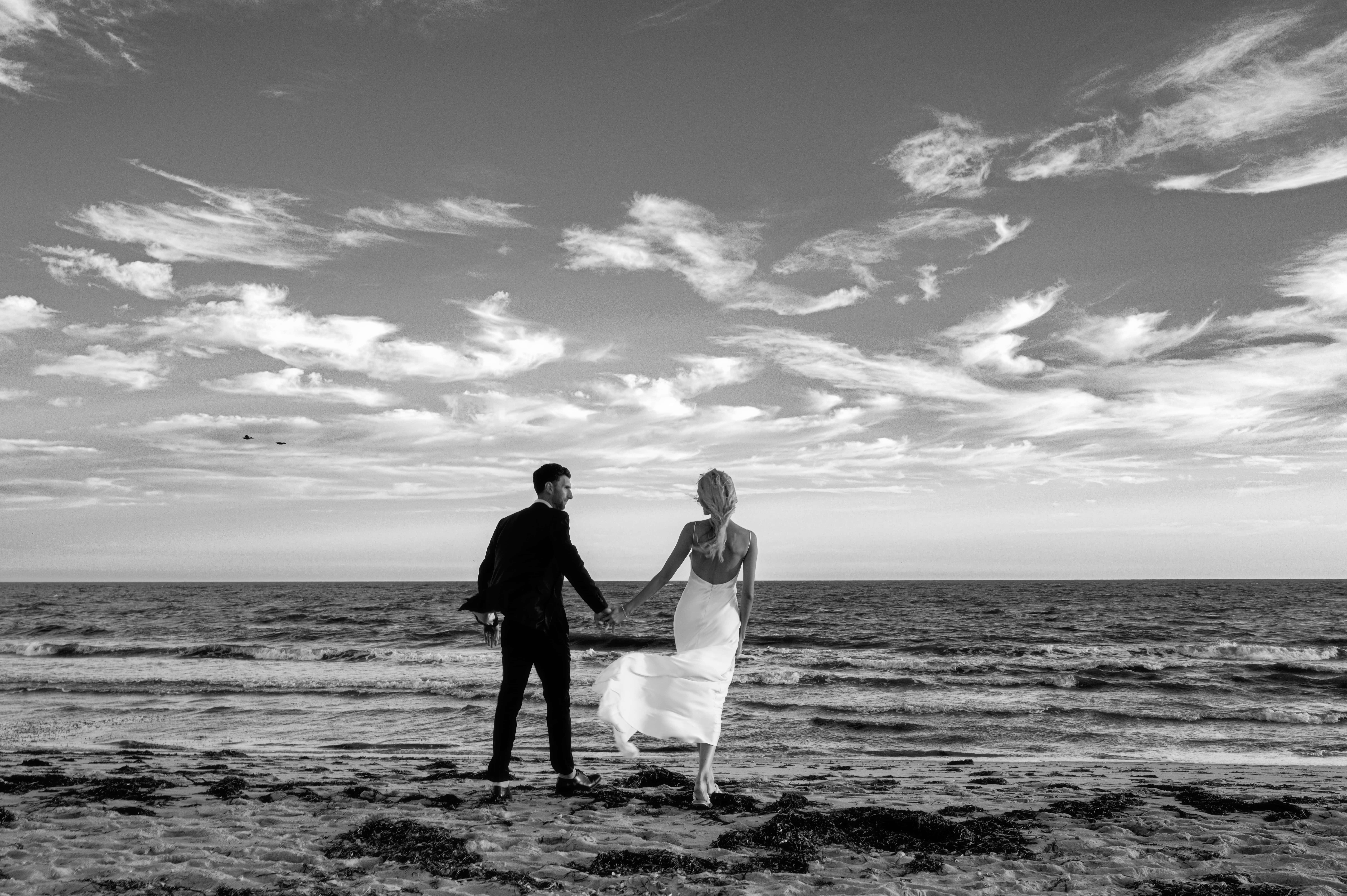 bride & groom on beach at Dune at Wychmere Beach Club for their wedding photos