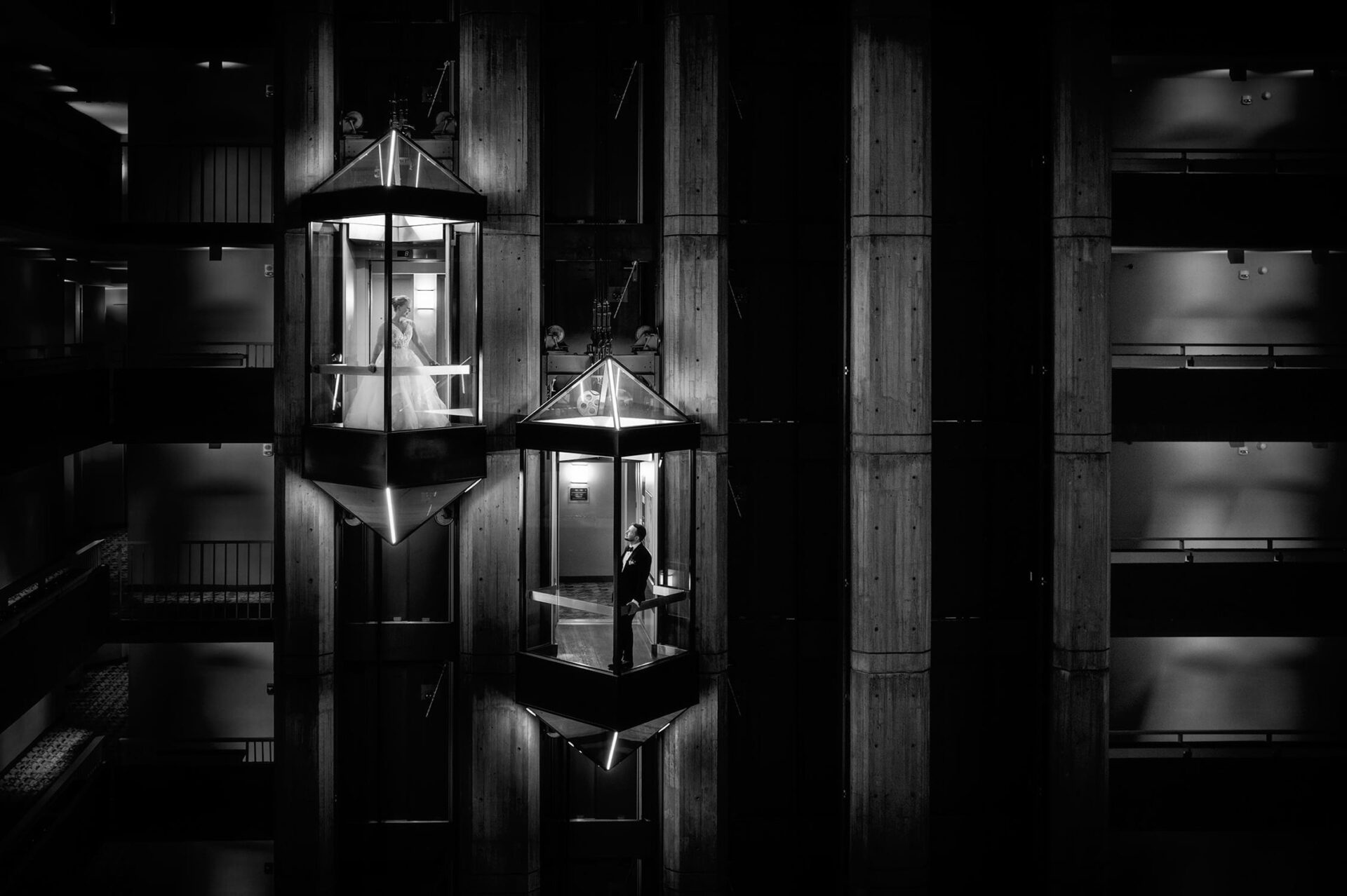 bride and groom in elevators at their hyatt regency cambridge wedding